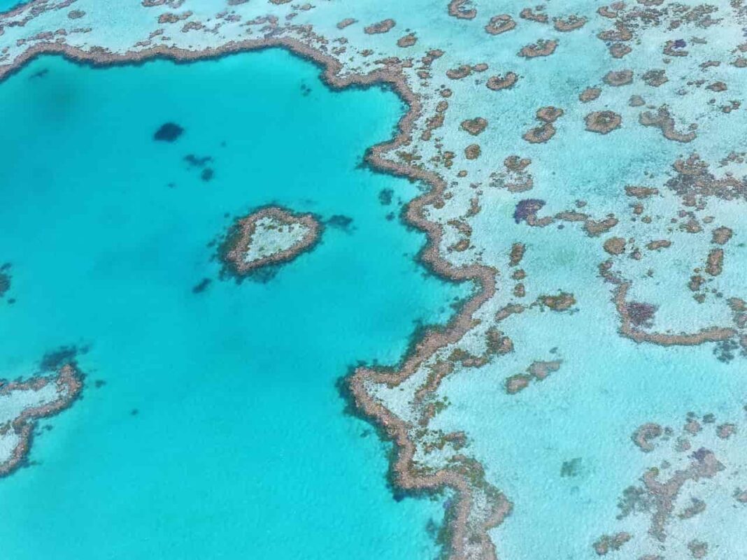 The Great Barrier Reef, a UNESCO World Heritage Site, is an iconic natural wonder that stretches along the Queensland coast in Australia.